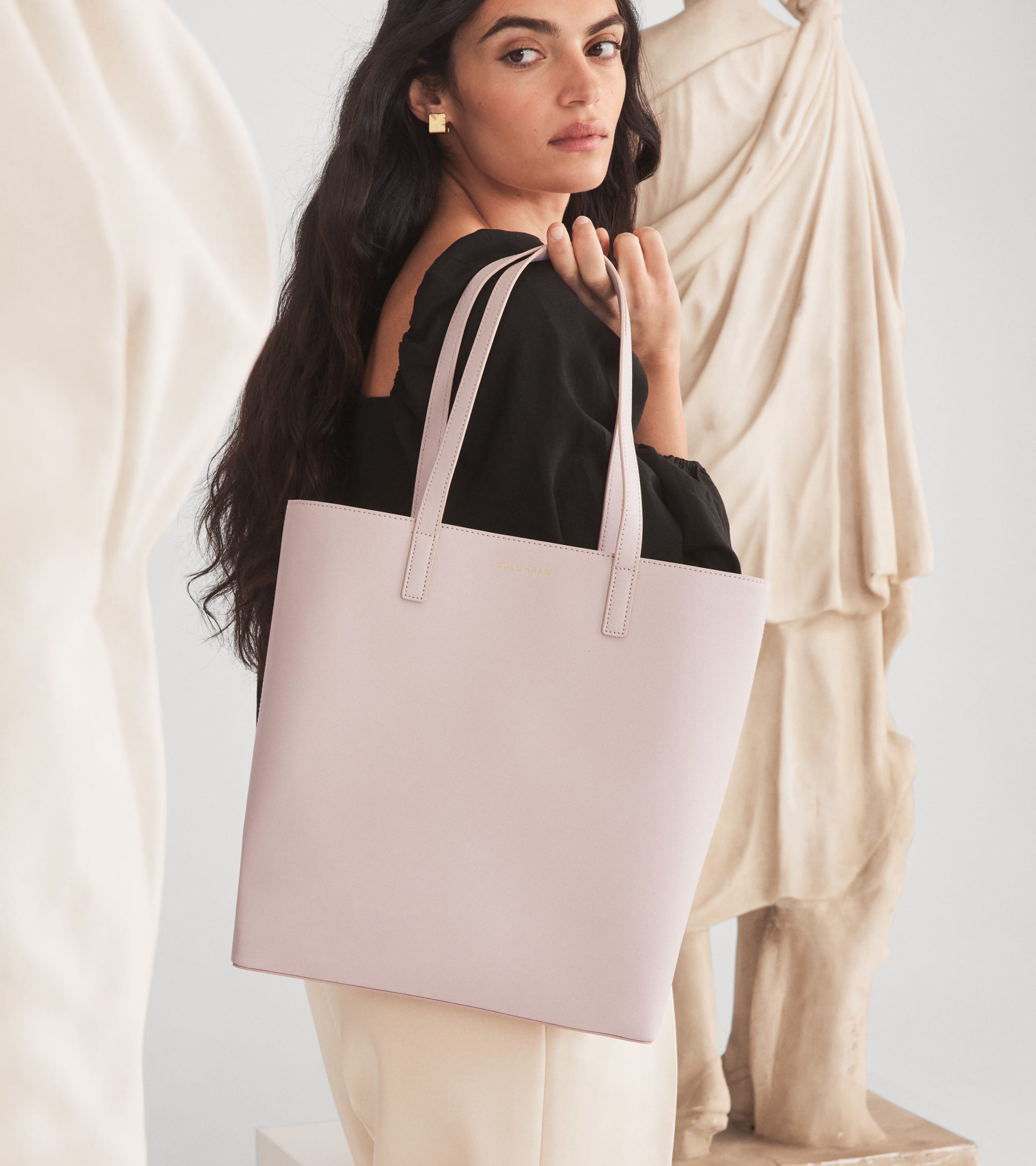 Female model holding a bag