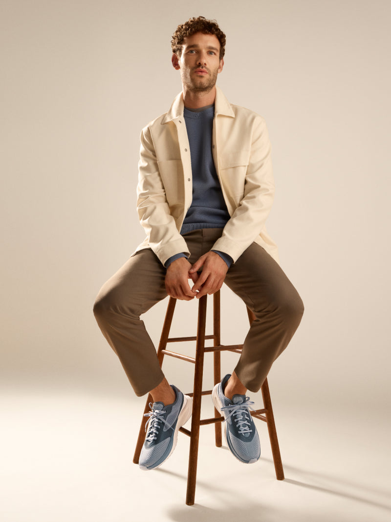 Man wearing blue sneakers