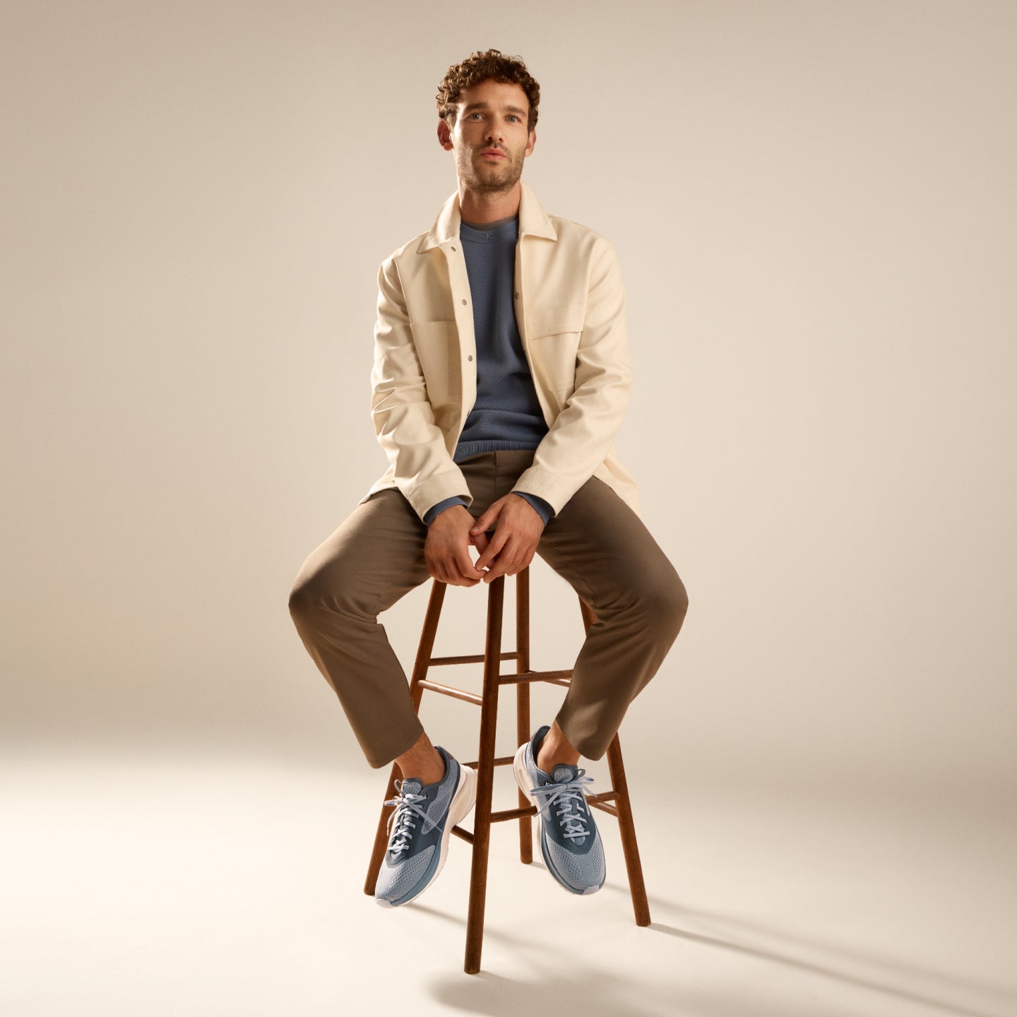 Man wearing blue sneakers
