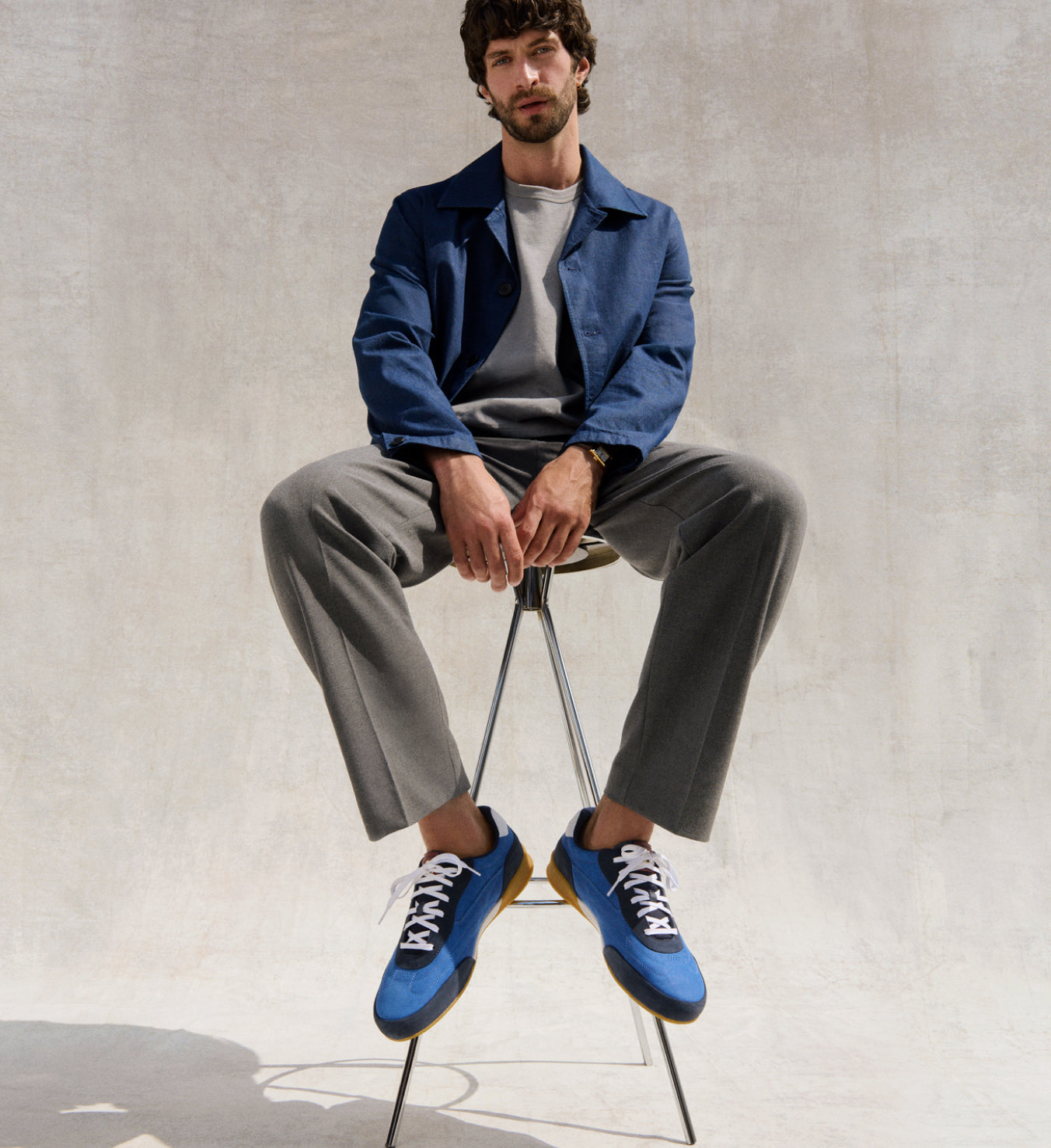 Man wearing blue sneakers