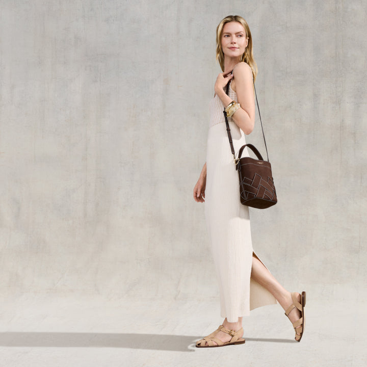 Woman wearing beige sandals