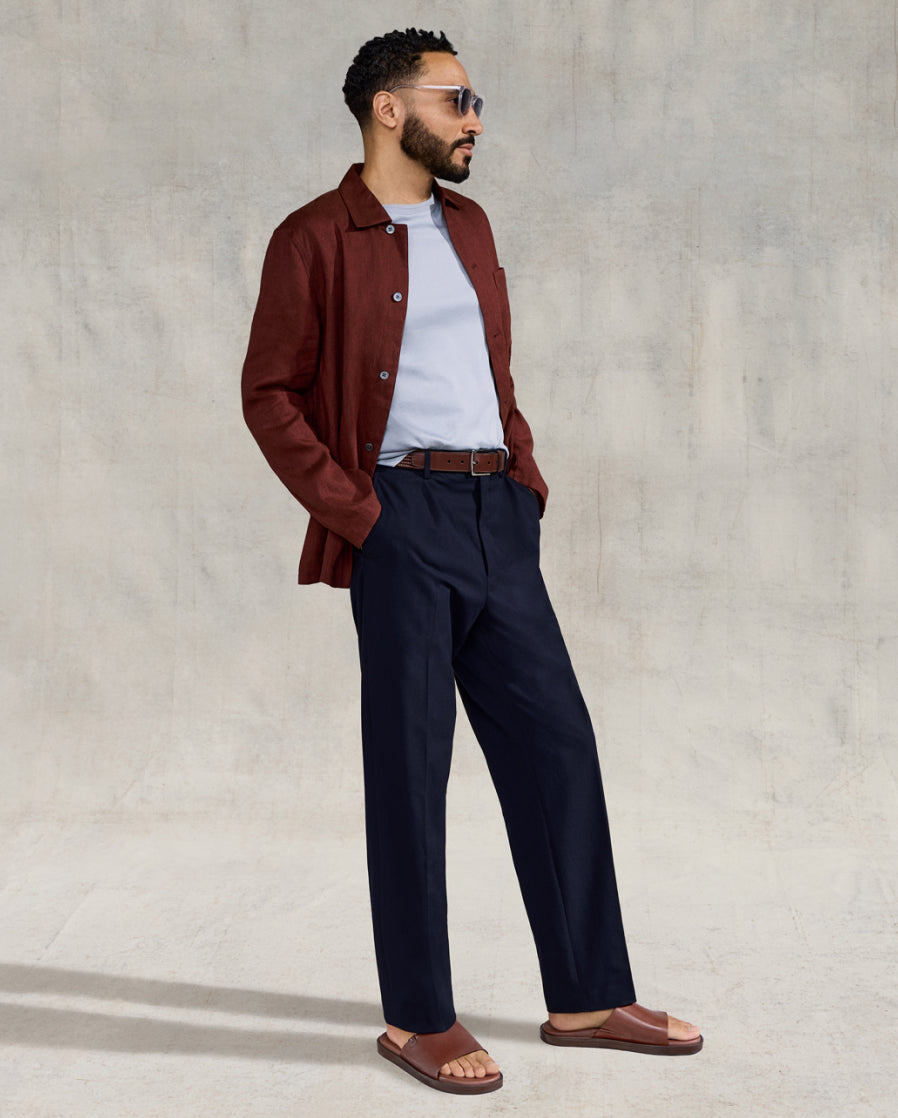 Man standing wearing brown sandals