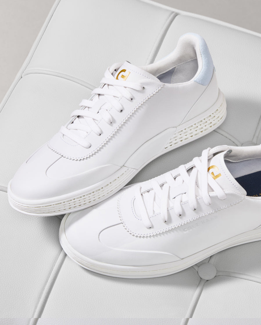 White sneakers on a light gray tiled floor