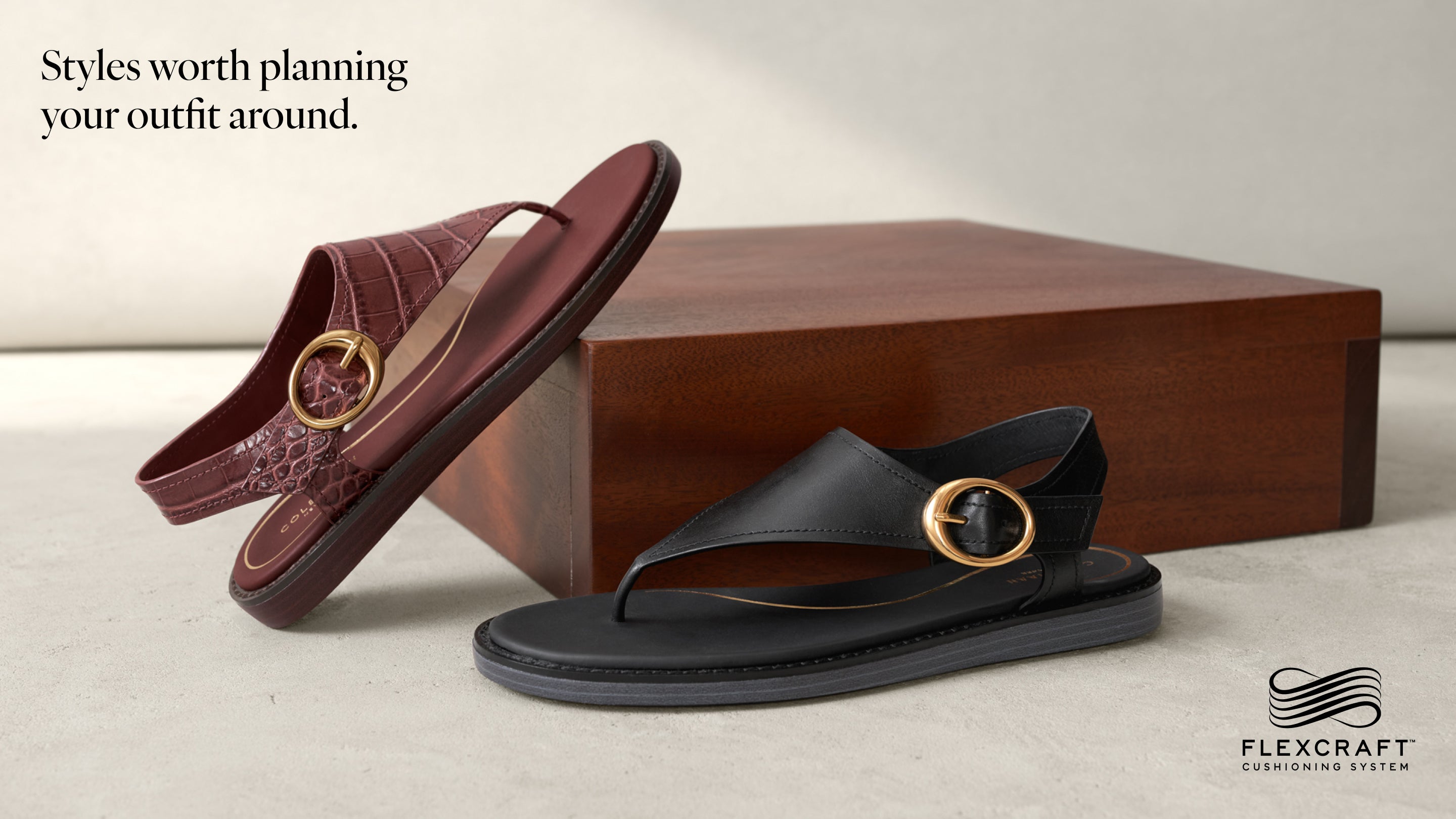 Brown and black sandals with gold buckles on a light background, Flexcraft logo visible.