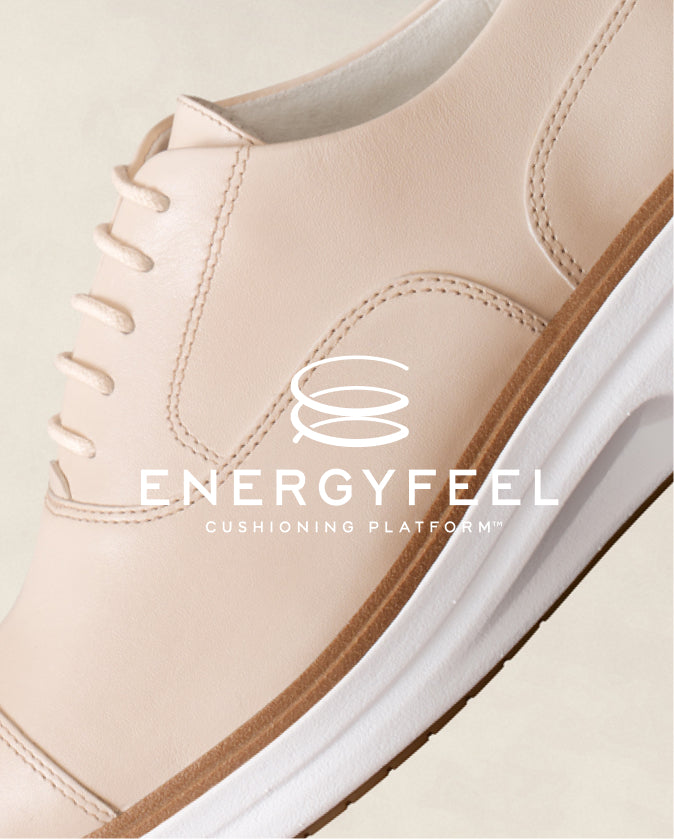 Beige sneaker with white sole and 'Energyfeel' branding on a light background