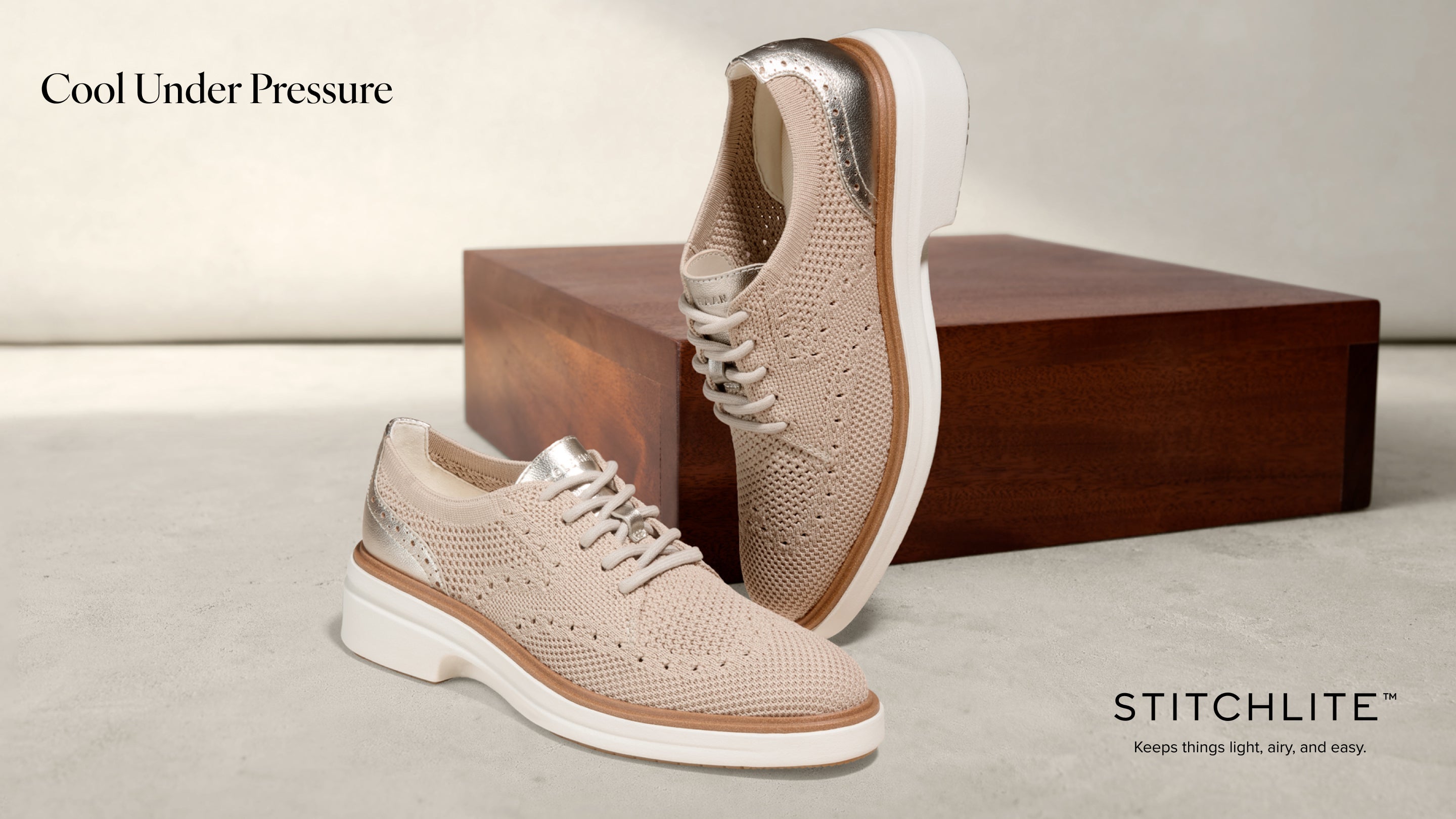 Beige oxfords with white soles on a light background