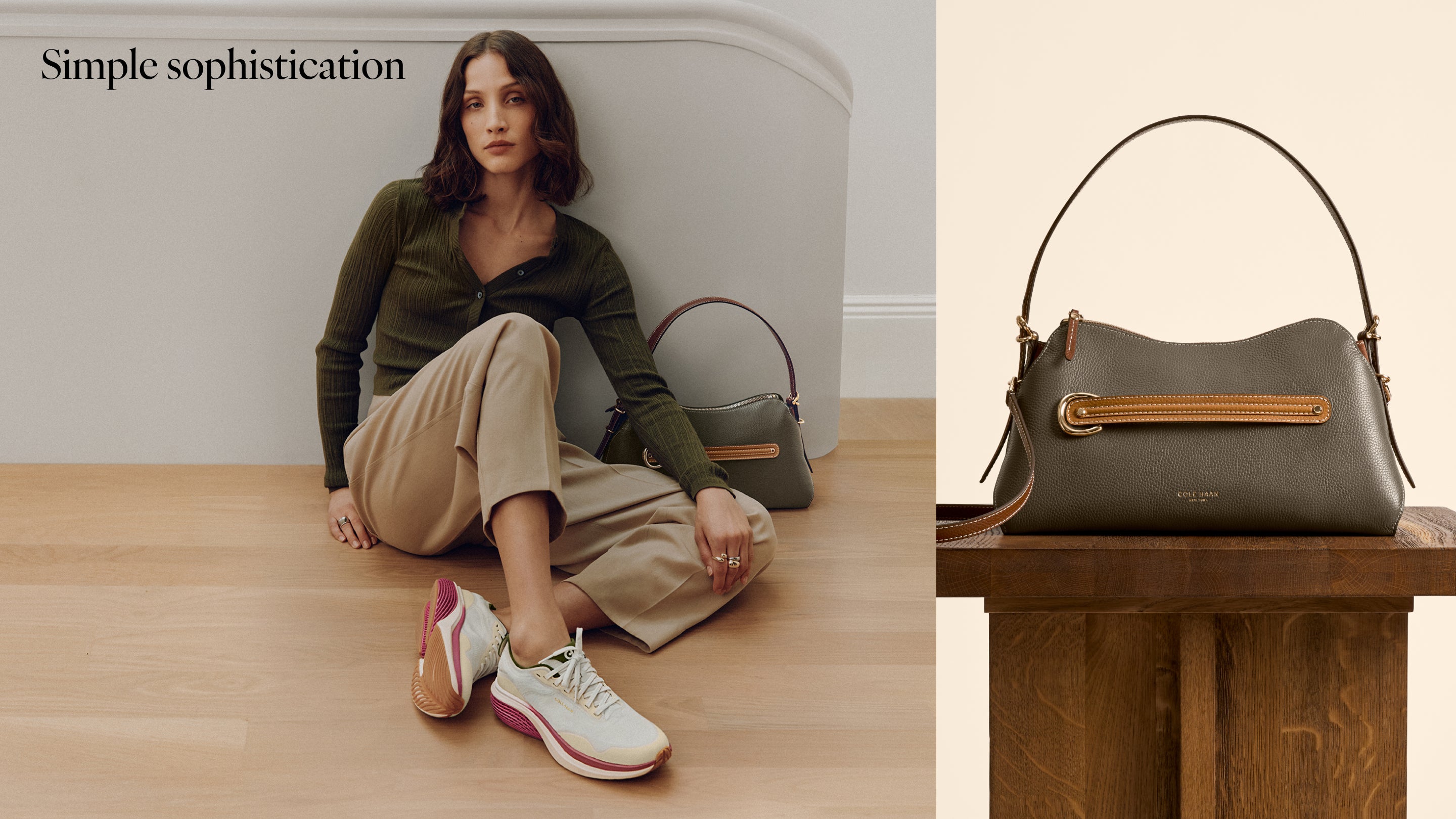 A woman sits on a wooden floor against a light gray wall wearing an olive green top, beige pants, and white sneakers with pink accents, while an olive handbag rests beside her. The right side shows a close-up of the handbag on a wooden table.