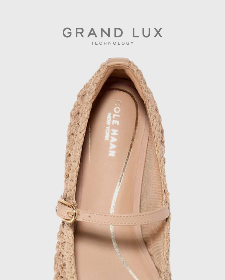 Beige flat shoe with crochet details on a light gray background.