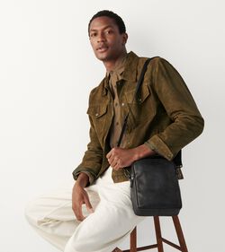 Male Model wearing a leather bag